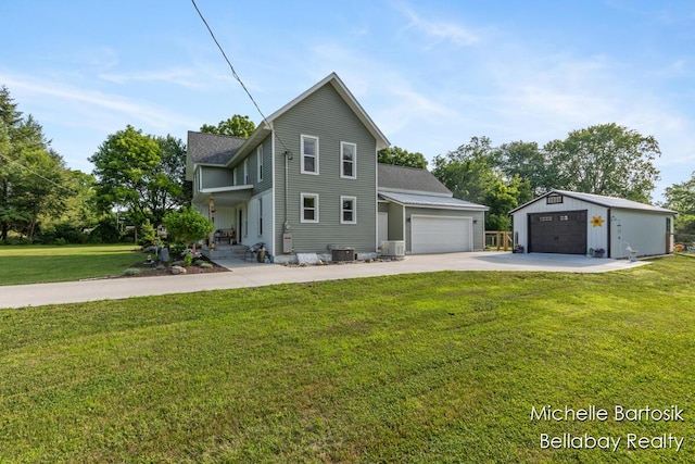 10840 Harvard Ave NE, Rockford, MI 49341 - traditional home with a front yard, concrete driveway, and an outdoor structure