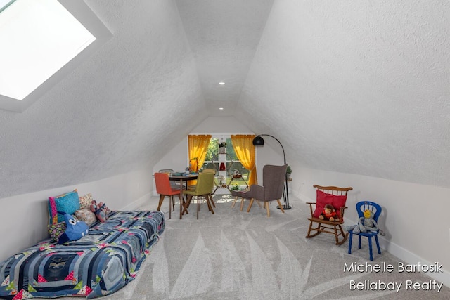 10840 Harvard Ave NE, Rockford, MI 49341 - rec room with lofted ceiling, a textured ceiling, a skylight, and carpet