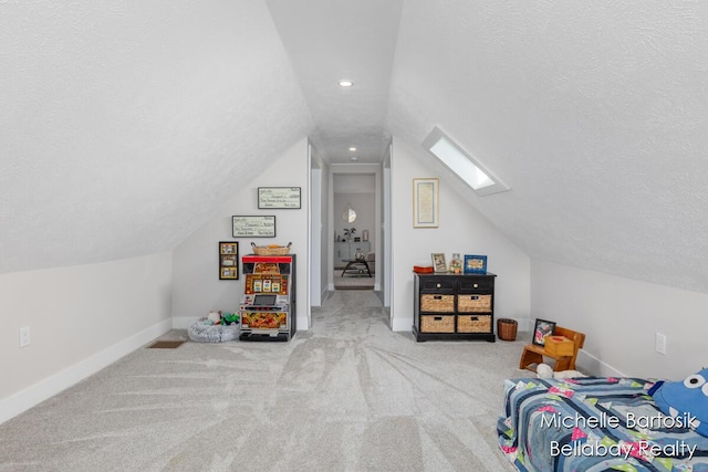 10840 Harvard Ave NE, Rockford, MI 49341 - bedroom featuring vaulted ceiling, a textured ceiling, carpet, a skylight, and recessed lighting