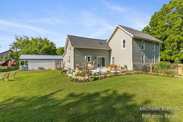 10840 Harvard Ave NE, Rockford, MI 49341 - rear view of house featuring a patio area and roof with shingles