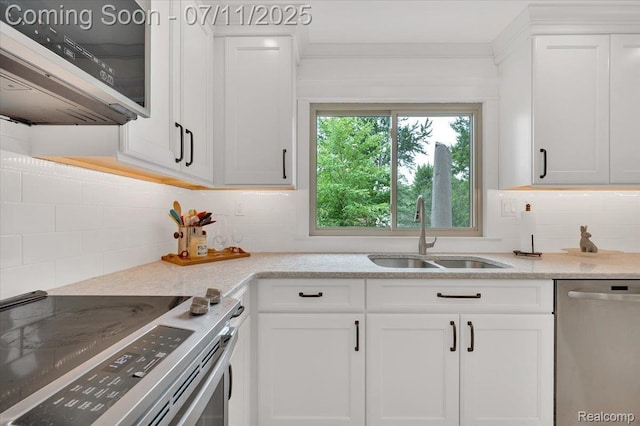 3417 Palm Aire Ct, Rochester Hills, MI 48309 - kitchen with stainless steel appliances, tasteful backsplash, and white cabinetry