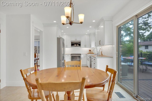 3417 Palm Aire Ct, Rochester Hills, MI 48309 - dining space featuring recessed lighting, a chandelier, and light tile patterned flooring