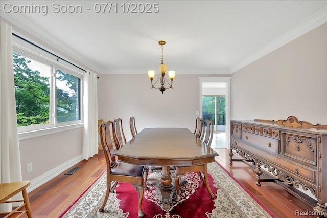 3417 Palm Aire Ct, Rochester Hills, MI 48309 - dining space featuring a chandelier, ornamental molding, and wood finished floors