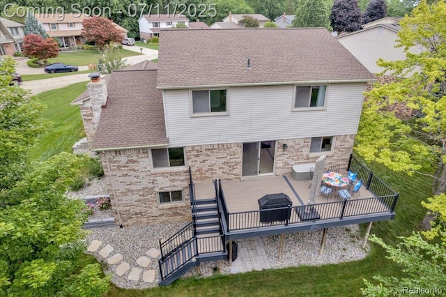 3417 Palm Aire Ct, Rochester Hills, MI 48309 - back of house with brick siding, a deck, a chimney, and stairs
