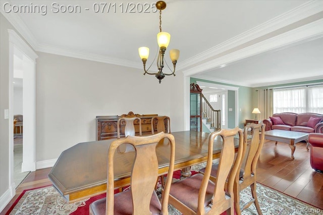 3417 Palm Aire Ct, Rochester Hills, MI 48309 - dining area with stairs, crown molding, wood finished floors, and a chandelier