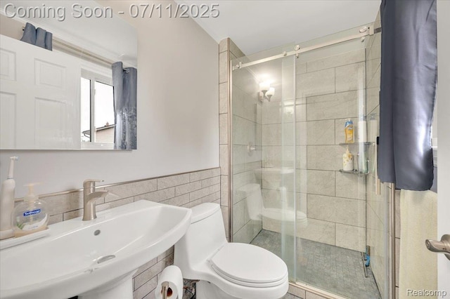 3417 Palm Aire Ct, Rochester Hills, MI 48309 - bathroom featuring a stall shower, tile walls, and wainscoting