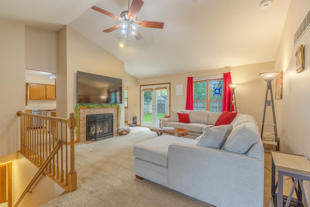 1428 Sherry Dr, Portage, MI 49024 - carpeted living room with a ceiling fan, a tile fireplace, and high vaulted ceiling