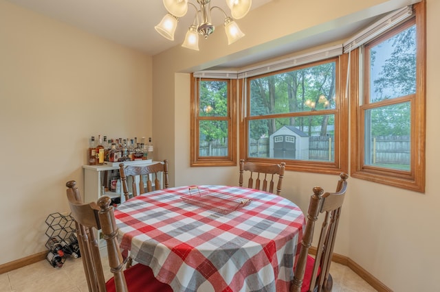 1428 Sherry Dr, Portage, MI 49024 - dining area featuring a chandelier and light tile patterned floors