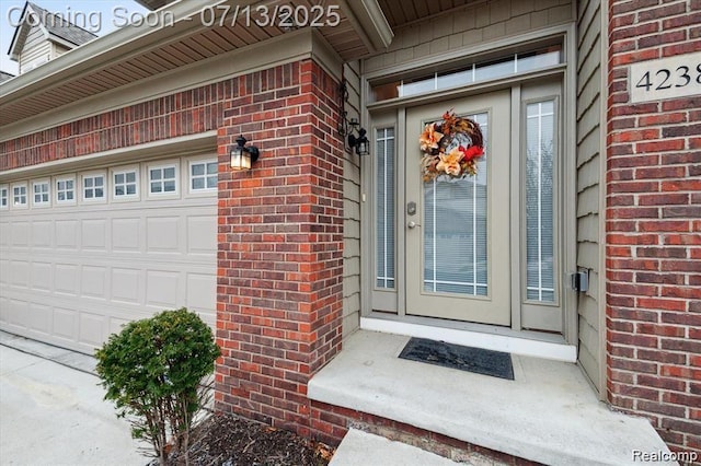 42384 Gateway Dr, Plymouth, MI 48170 - doorway to property with brick siding and a garage