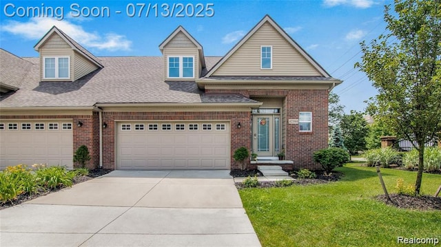 42384 Gateway Dr, Plymouth, MI 48170 - view of front facade featuring brick siding, a front yard, roof with shingles, and concrete driveway
