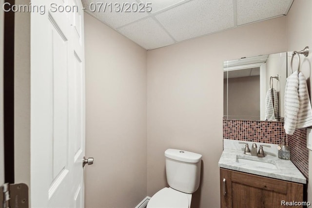 42384 Gateway Dr, Plymouth, MI 48170 - half bath with a paneled ceiling, vanity, and backsplash