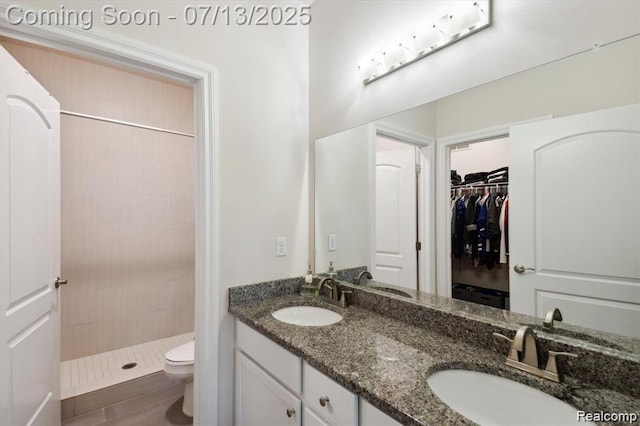42384 Gateway Dr, Plymouth, MI 48170 - full bath featuring double vanity, tiled shower, and a spacious closet