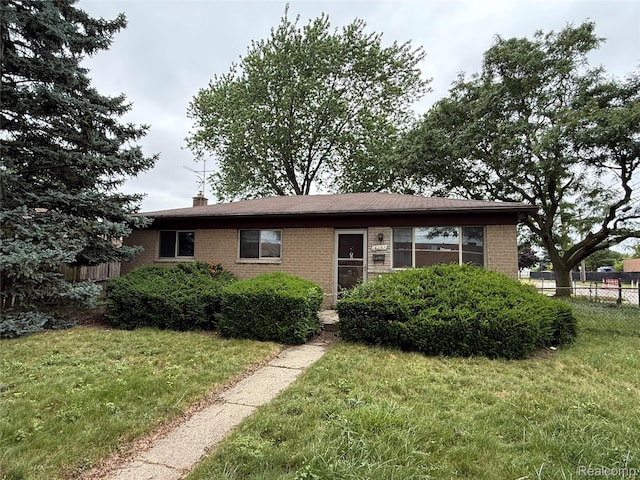 16061 Common Rd, Roseville, MI 48066 - single story home with brick siding and a chimney