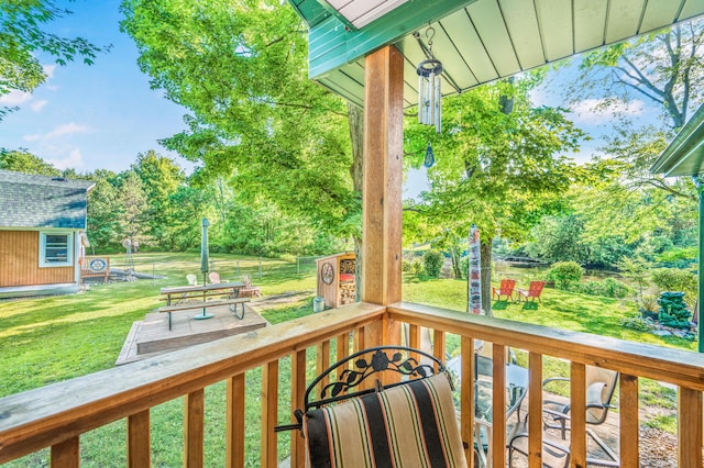 76 Meceola Ct, Hersey, MI 49639 - deck featuring a lawn, a storage shed, and view of scattered trees