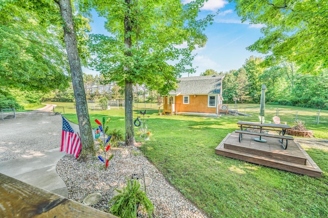 76 Meceola Ct, Hersey, MI 49639 - view of yard with a wooden deck and an outbuilding
