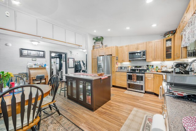 76 Meceola Ct, Hersey, MI 49639 - kitchen with stainless steel appliances, light wood-type flooring, light brown cabinetry, and recessed lighting