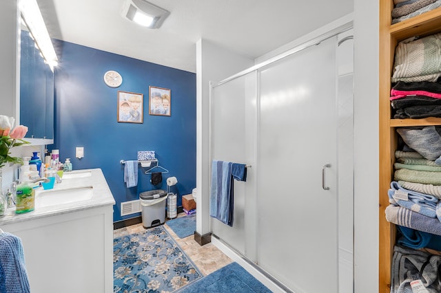 76 Meceola Ct, Hersey, MI 49639 - full bathroom featuring a shower stall, stone finish flooring, and double vanity