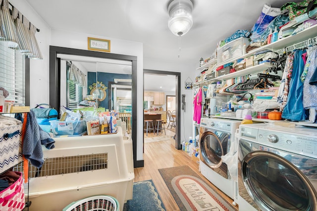 76 Meceola Ct, Hersey, MI 49639 - laundry area featuring washing machine and dryer, wood finished floors, and ceiling fan