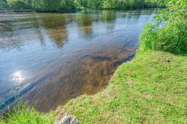 76 Meceola Ct, Hersey, MI 49639 - water view with a heavily wooded area
