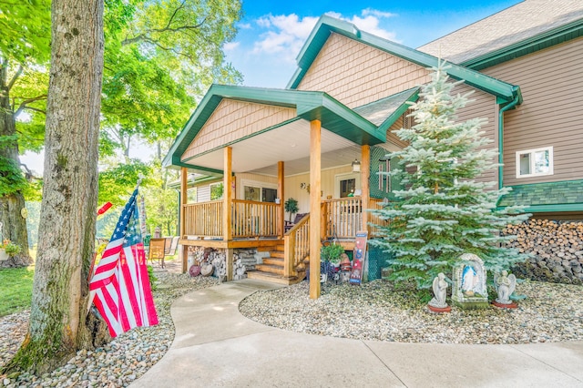 76 Meceola Ct, Hersey, MI 49639 - view of front of home featuring covered porch and roof with shingles