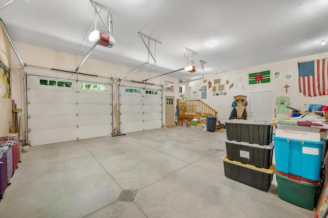 76 Meceola Ct, Hersey, MI 49639 - garage featuring a garage door opener