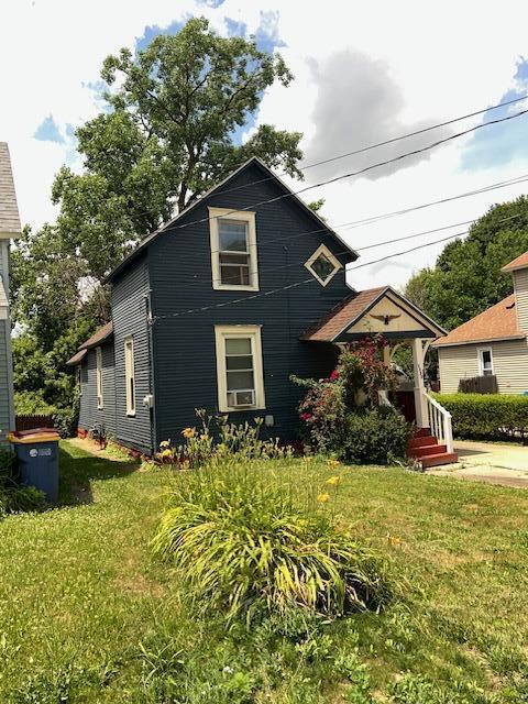 1325 Maude Ave NE, Grand Rapids, MI 49505 - view of front of property featuring a front lawn
