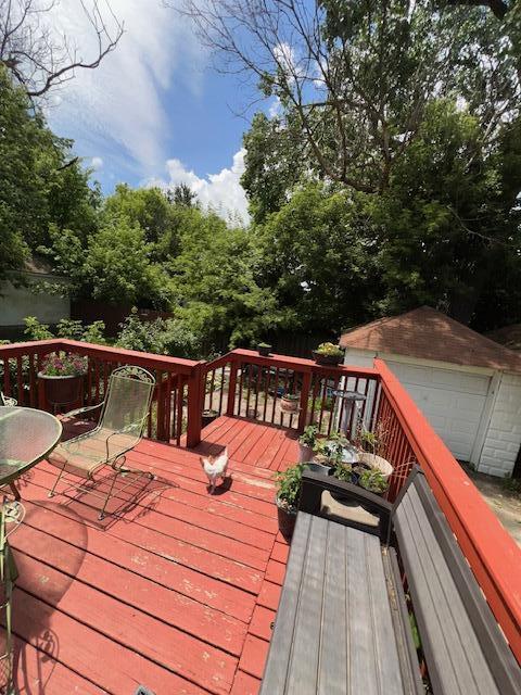 1325 Maude Ave NE, Grand Rapids, MI 49505 - wooden terrace with an outdoor structure and a garage
