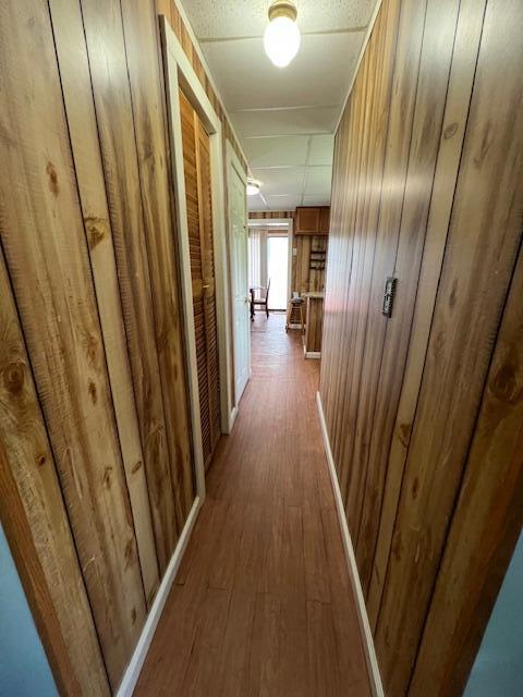1325 Maude Ave NE, Grand Rapids, MI 49505 - hallway featuring wooden walls and wood finished floors