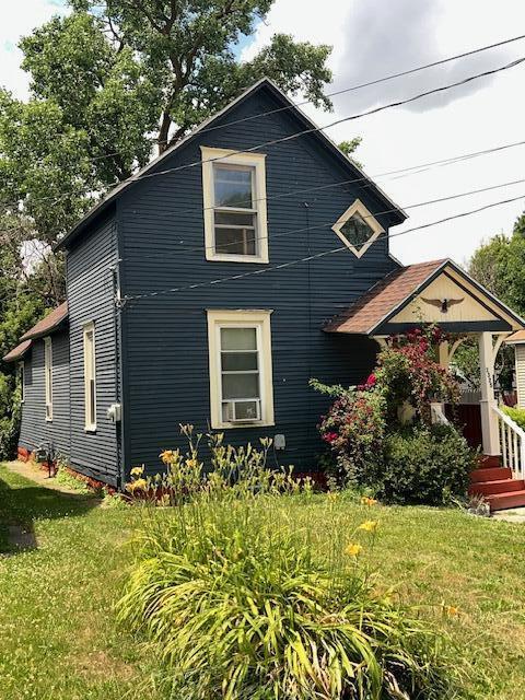 1325 Maude Ave NE, Grand Rapids, MI 49505 - view of front of property featuring a front yard and cooling unit