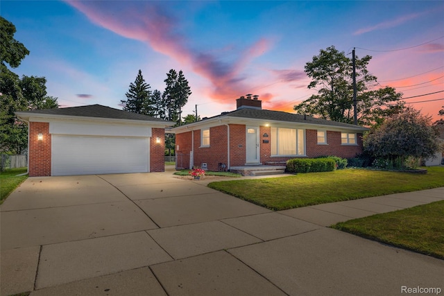 1024 London Ave, Lincoln Park, MI 48146 - single story home with brick siding, a garage, a chimney, and a lawn