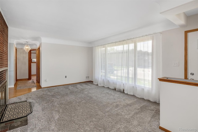 1024 London Ave, Lincoln Park, MI 48146 - unfurnished living room featuring carpet flooring and a fireplace