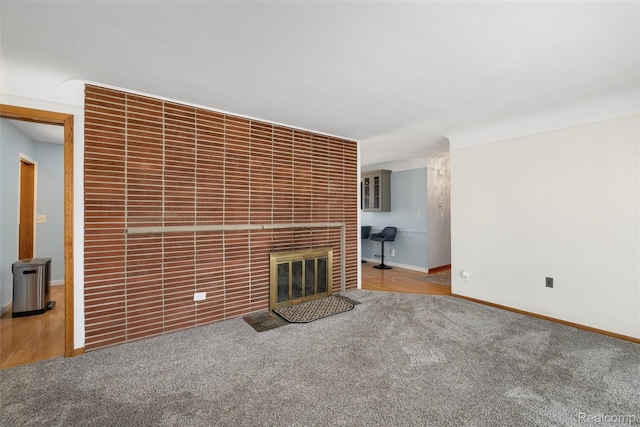1024 London Ave, Lincoln Park, MI 48146 - unfurnished living room with carpet flooring and a fireplace