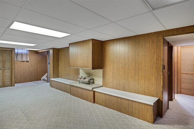 1024 London Ave, Lincoln Park, MI 48146 - bar featuring carpet flooring, wood walls, stairs, and a paneled ceiling