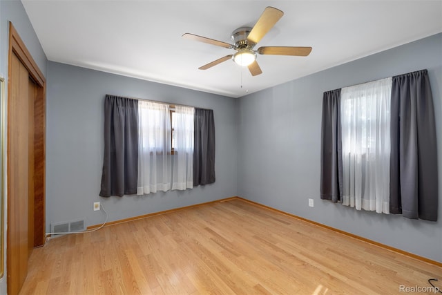 1024 London Ave, Lincoln Park, MI 48146 - unfurnished bedroom featuring wood finished floors, a closet, and a ceiling fan