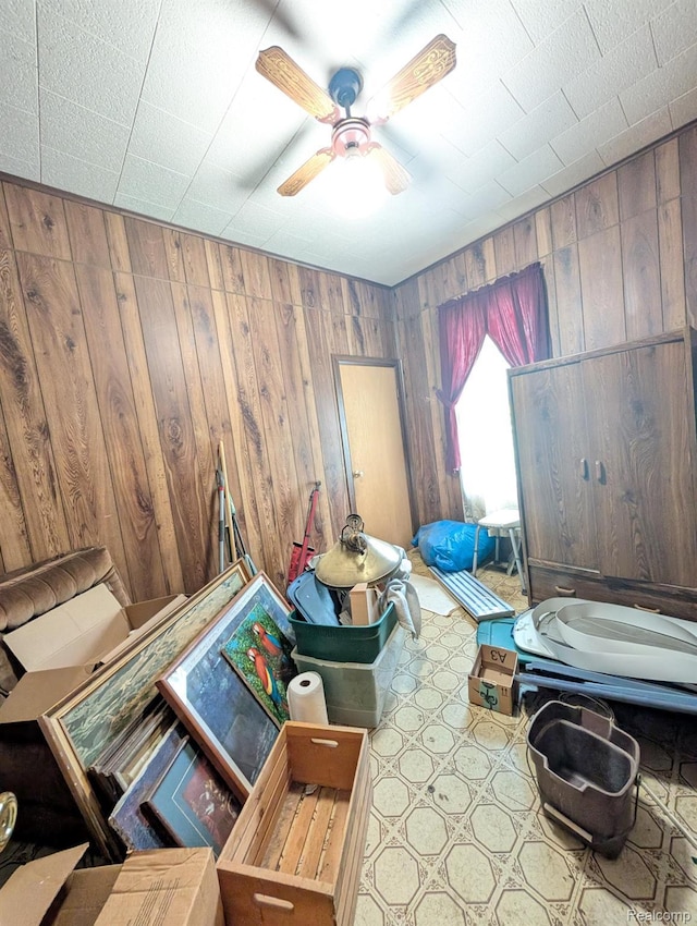 1402 Allen St, Burton, MI 48529 - bedroom featuring wooden walls and ceiling fan