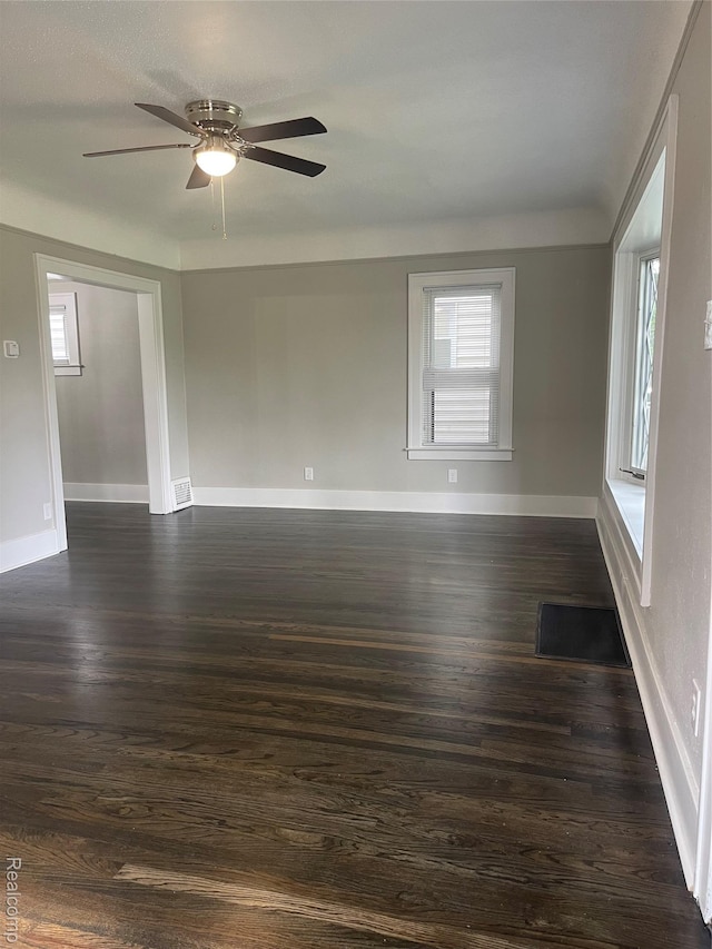 160 Emmons Blvd, Wyandotte, MI 48192 - empty room with dark wood finished floors and a ceiling fan