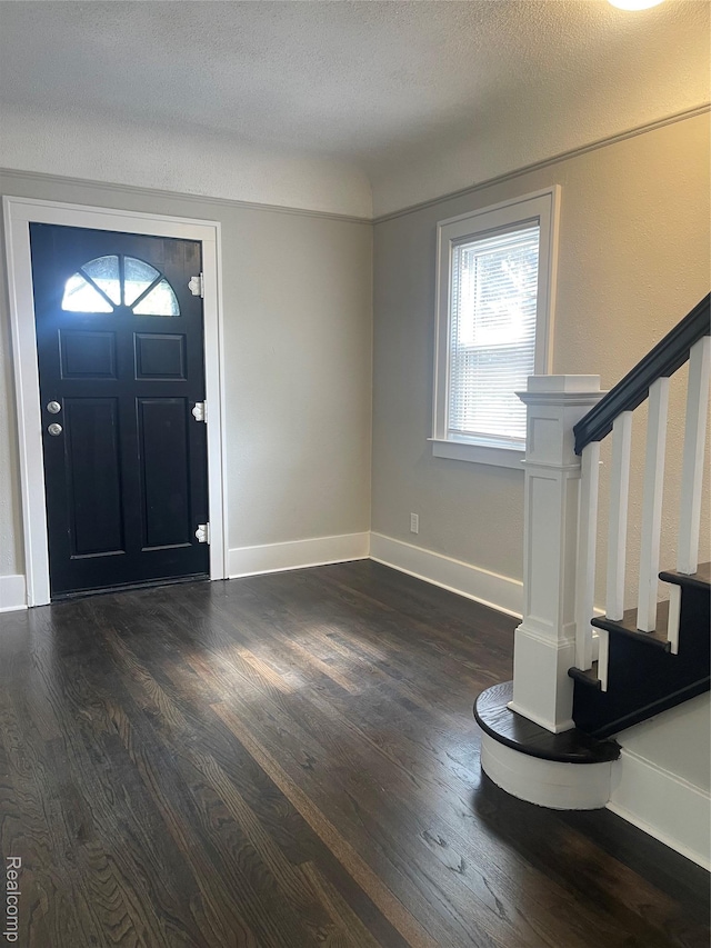 160 Emmons Blvd, Wyandotte, MI 48192 - entrance foyer featuring stairway, dark wood-style flooring, and a textured ceiling