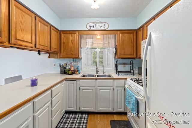 331 Conkey Dr, Michigan, MI 48834 - kitchen with white appliances, light countertops, light wood-type flooring, and white cabinets