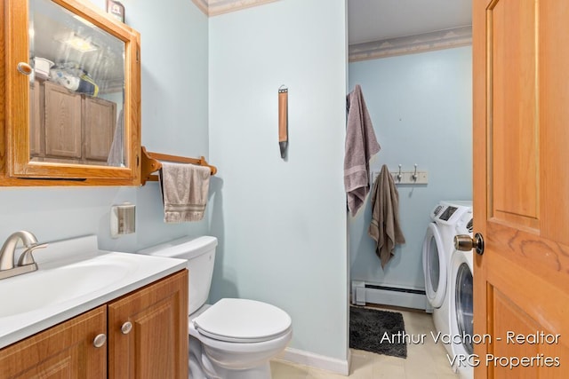 331 Conkey Dr, Michigan, MI 48834 - half bathroom with washer and clothes dryer, a baseboard radiator, vanity, and tile patterned floors