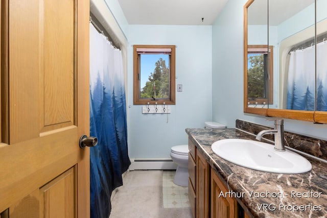 331 Conkey Dr, Michigan, MI 48834 - bathroom featuring a baseboard heating unit, vanity, healthy amount of natural light, and tile patterned floors