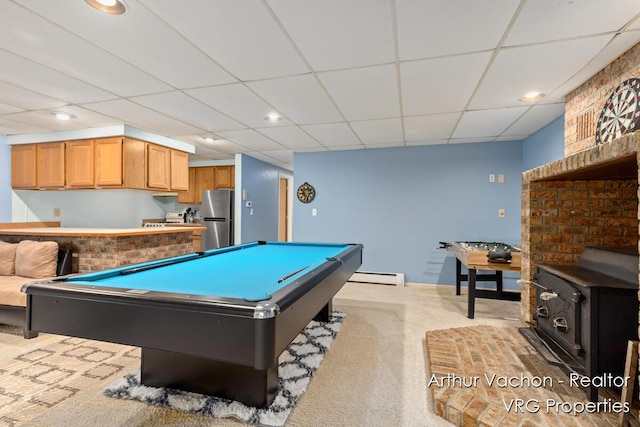 331 Conkey Dr, Michigan, MI 48834 - recreation room featuring a baseboard heating unit, a wood stove, a paneled ceiling, recessed lighting, and pool table