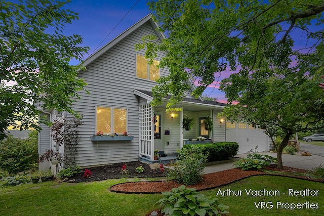 331 Conkey Dr, Michigan, MI 48834 - view of front facade featuring a porch, an attached garage, concrete driveway, and a front lawn