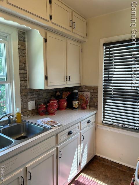 1431 Denies St, Burton, MI 48509 - kitchen with light countertops, healthy amount of natural light, and white cabinets