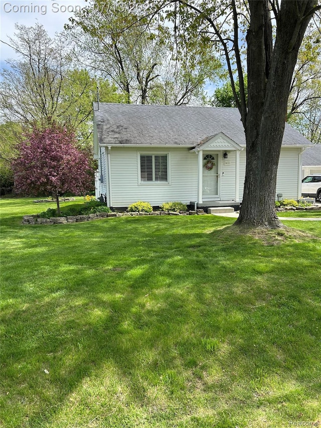 1431 Denies St, Burton, MI 48509 - view of front of property with a front yard and a shingled roof