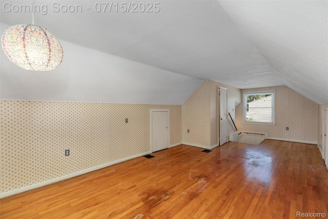 20225 Shady Lane Ave, Saint Clair Shores, MI 48080 - bonus room featuring wood-type flooring, lofted ceiling, and a chandelier