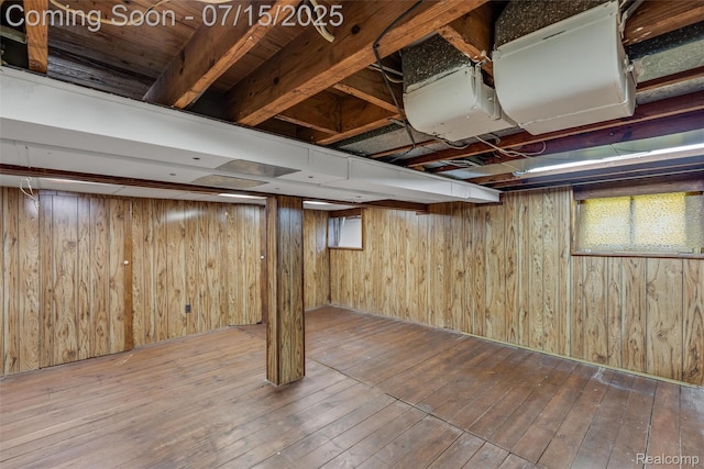 20225 Shady Lane Ave, Saint Clair Shores, MI 48080 - basement featuring hardwood / wood-style floors, wood walls, and plenty of natural light