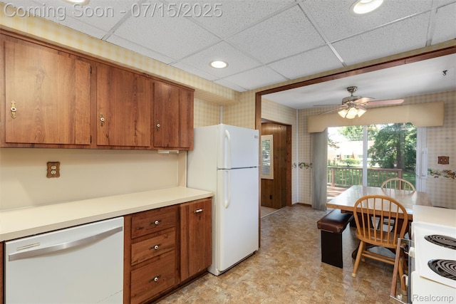 20225 Shady Lane Ave, Saint Clair Shores, MI 48080 - kitchen with white appliances, brown cabinets, light countertops, a ceiling fan, and wallpapered walls