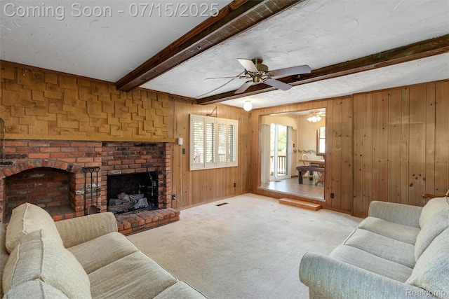 20225 Shady Lane Ave, Saint Clair Shores, MI 48080 - living room with wood walls, beamed ceiling, a fireplace, a ceiling fan, and carpet
