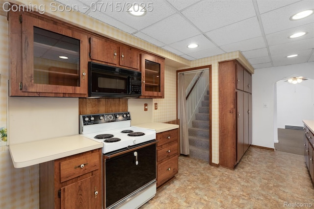 20225 Shady Lane Ave, Saint Clair Shores, MI 48080 - kitchen with white range with electric stovetop, black microwave, light countertops, recessed lighting, and a paneled ceiling