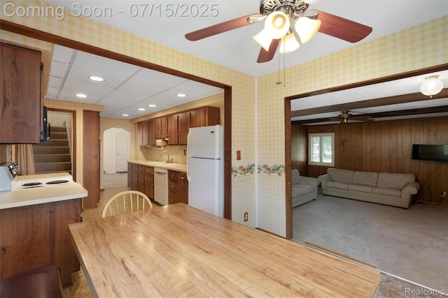 20225 Shady Lane Ave, Saint Clair Shores, MI 48080 - dining room with a ceiling fan, wallpapered walls, stairway, arched walkways, and light carpet